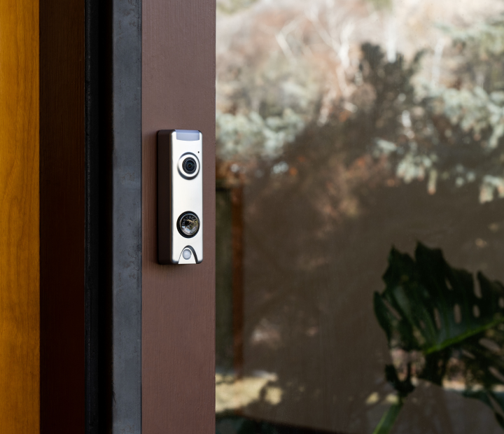 Skybell doorbell camera on door.