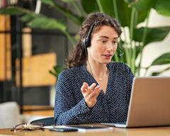 woman giving customer support over phone