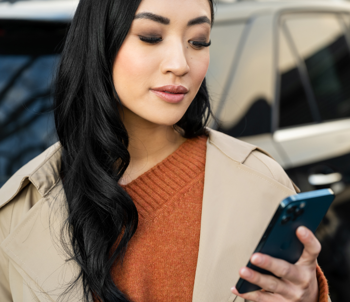 woman looking at security notification on phone