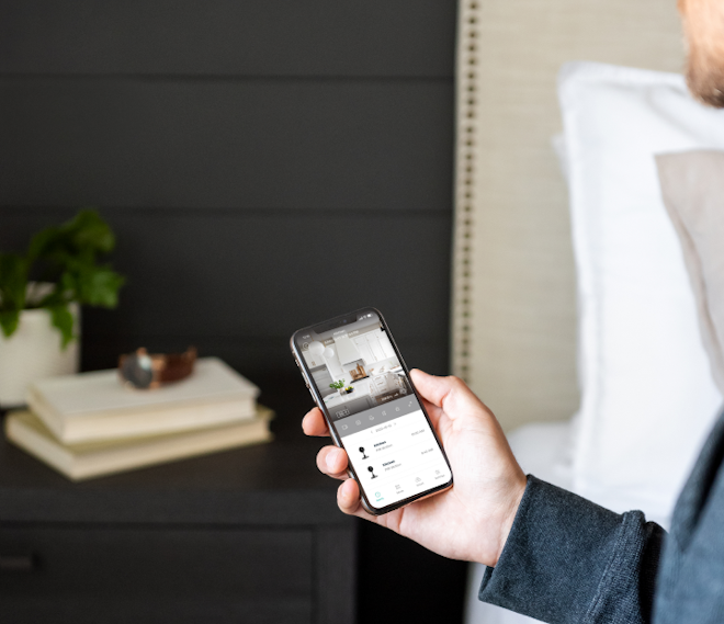 Man holding phone with Cove app open