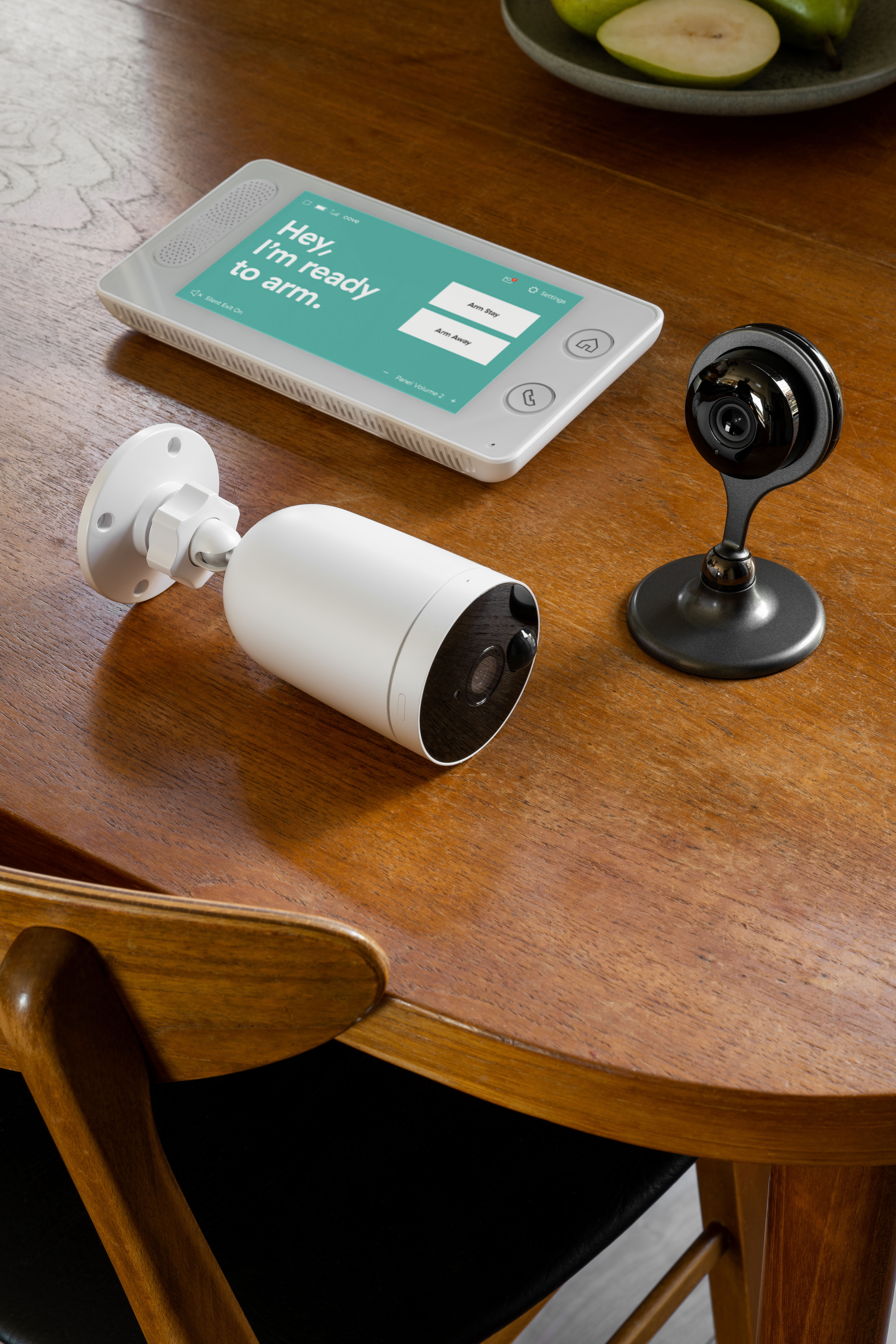 Cove's home security cameras and panel on a table.