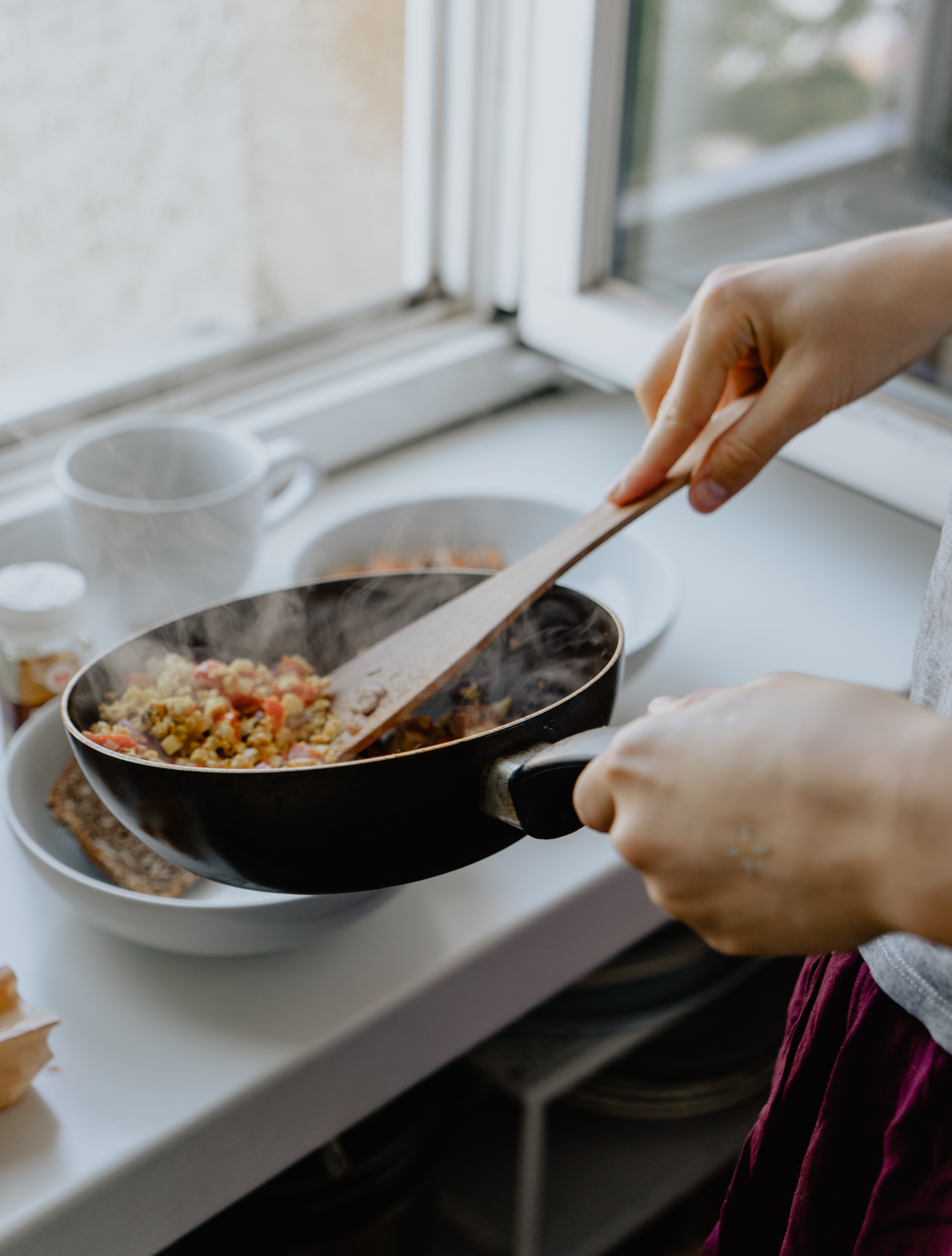 Cooking food in a pan in a home kitchen.