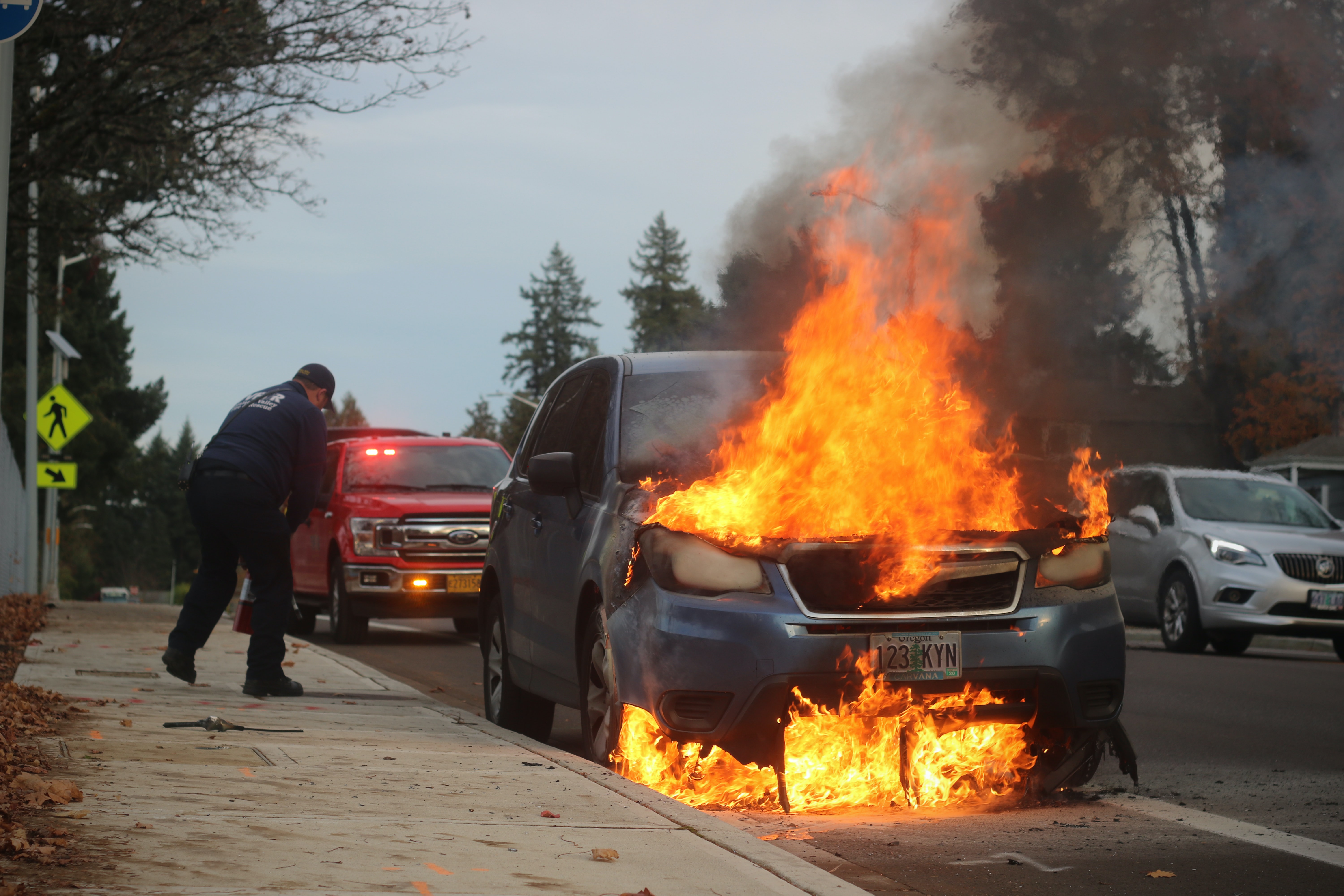 Emergency personnel respond to a vehicle fire.