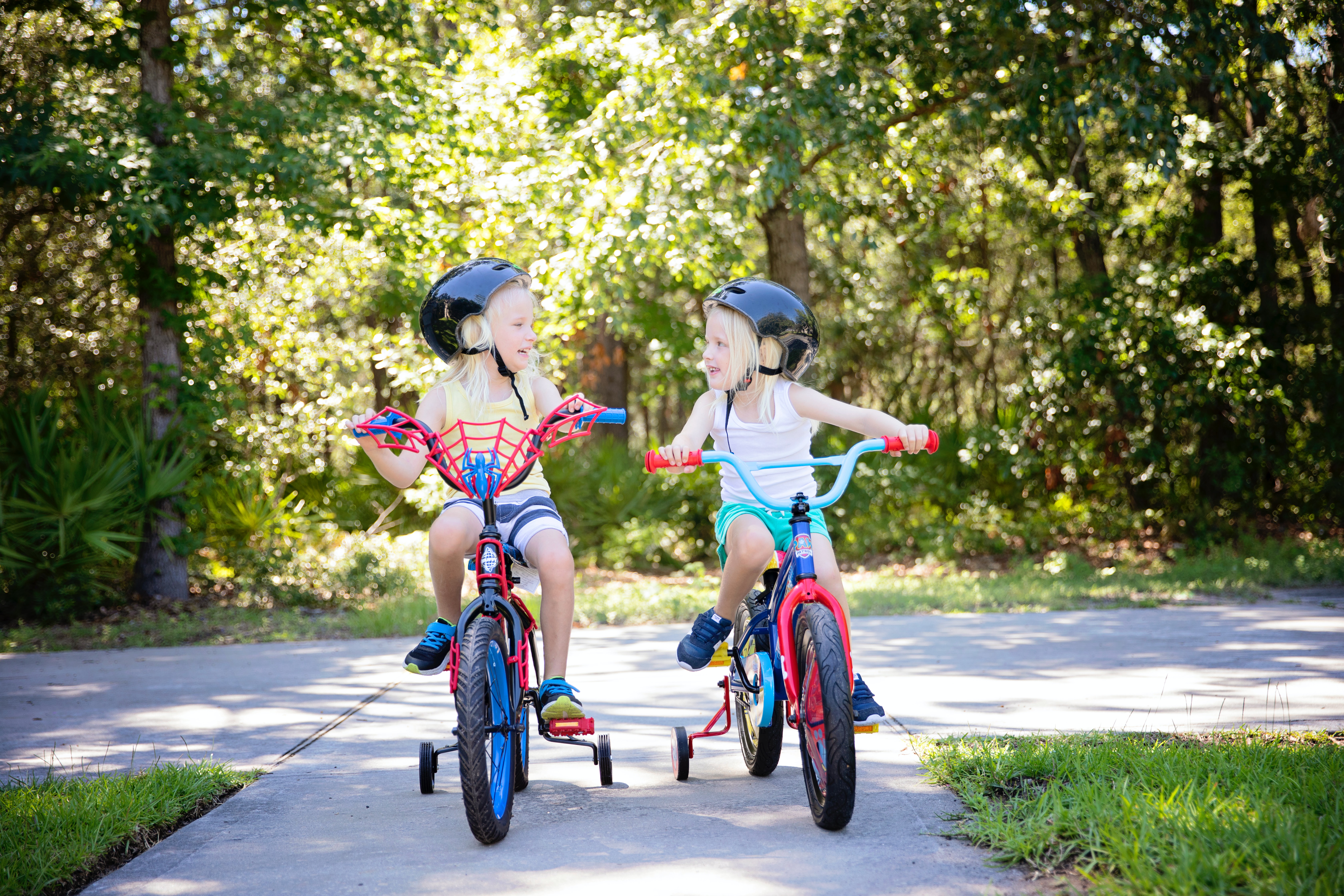 Two girls riding bicycles