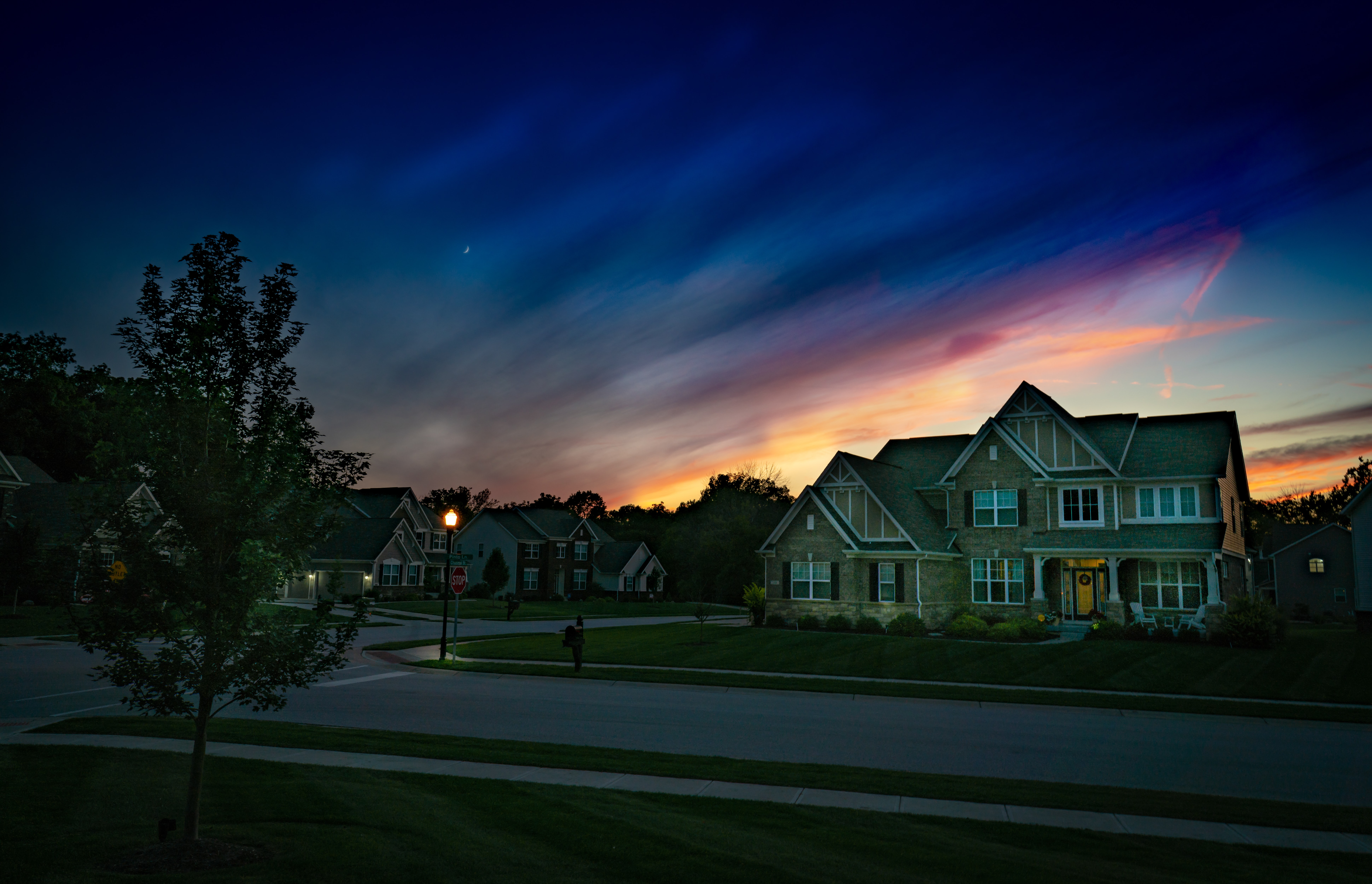 Home without lights on at sunset.