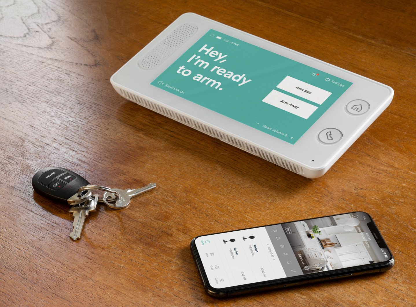 Cove home security panel, keys, and phone.