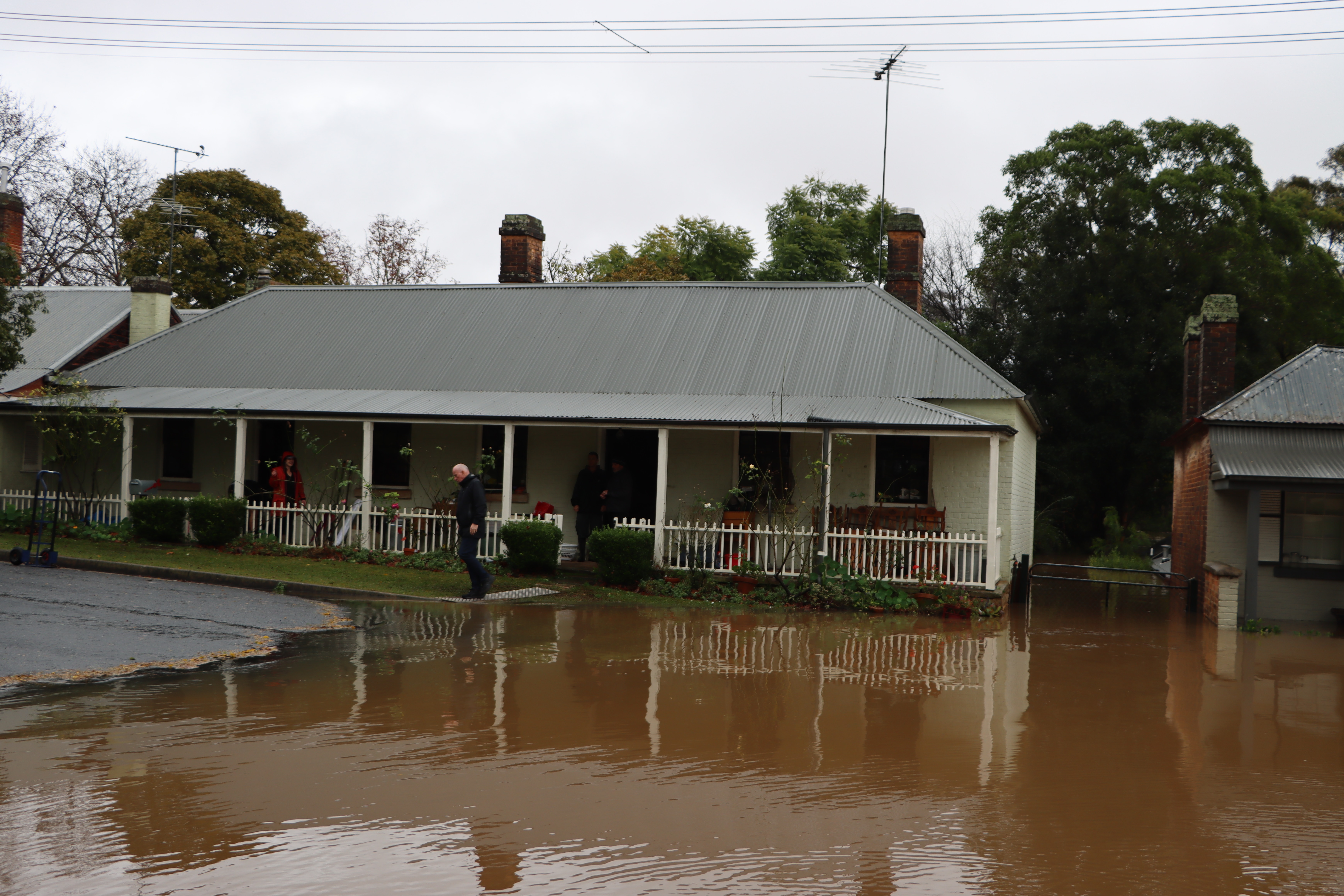Brown flood waters creeping into a home.