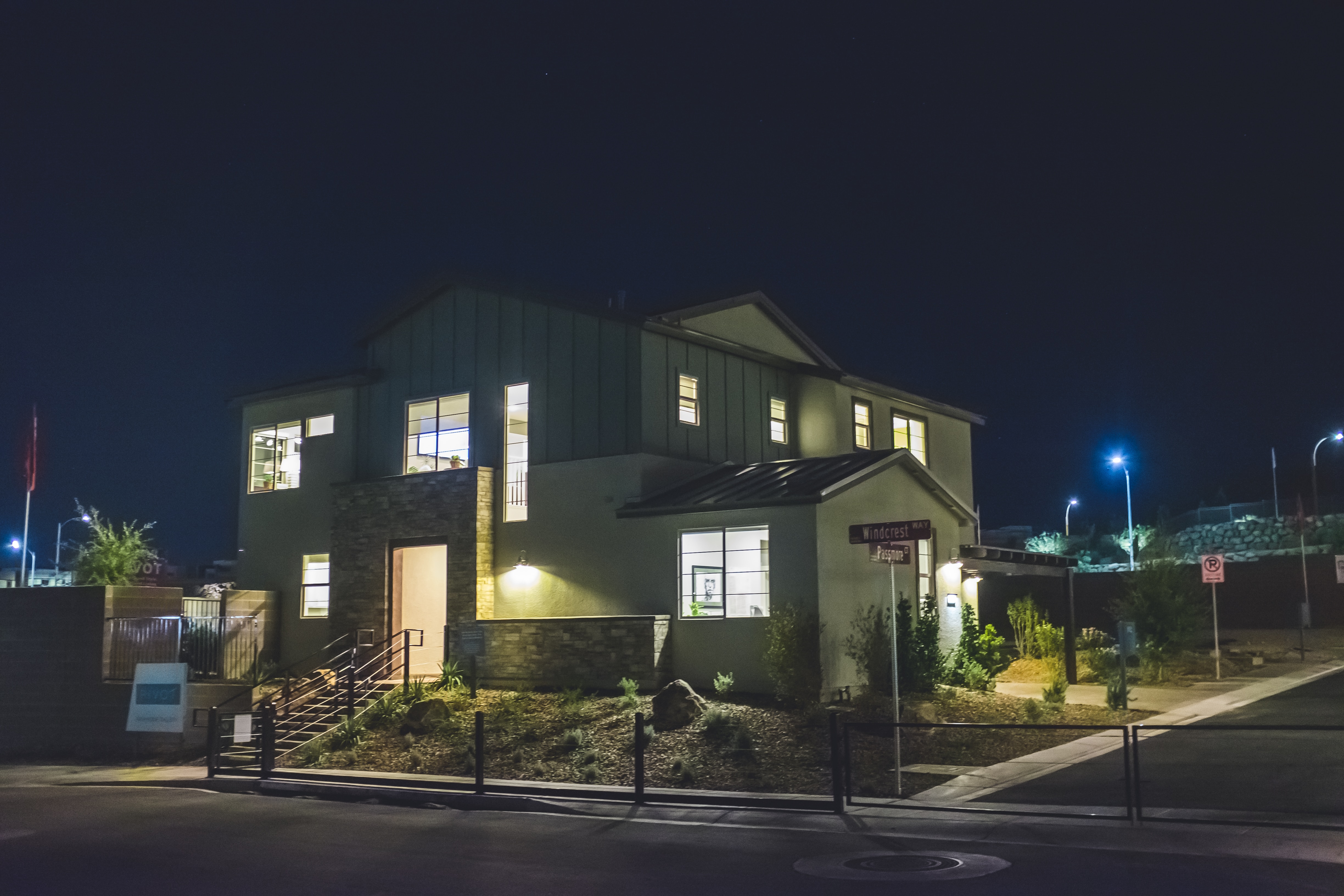 Motion detector lights at a home in the evening.