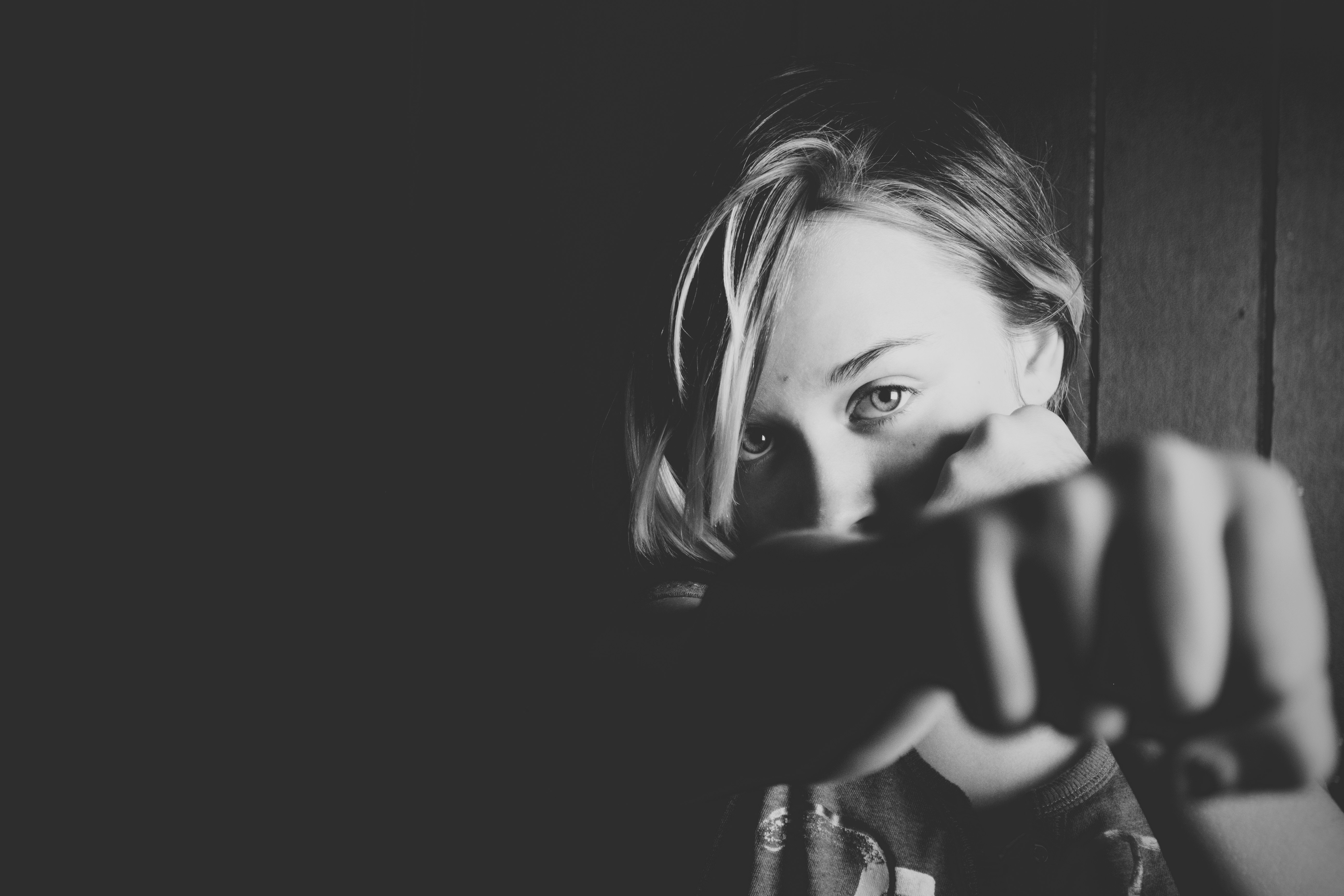 Woman doing a self defense move.