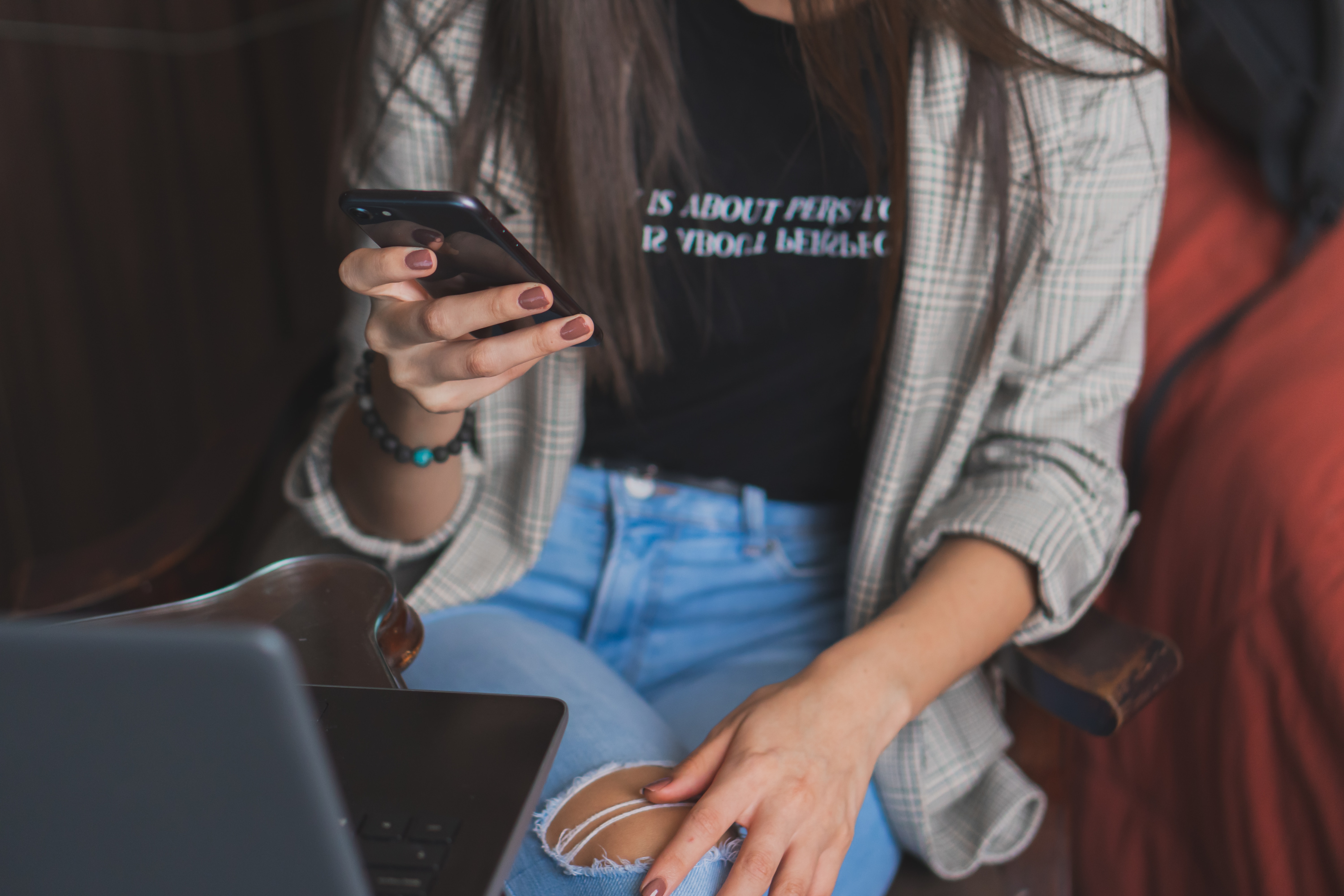 Woman texting a friend to tell her she's safe.