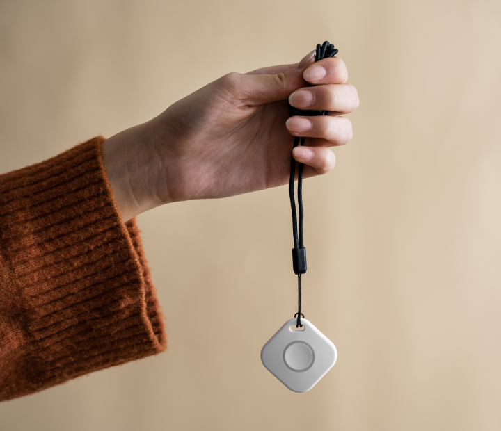 Woman holding medical alert button