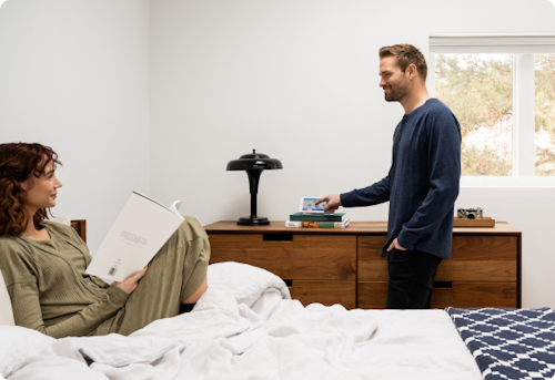 Couple in room arming Cove Alarm Panel