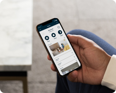 Hand holding smartphone with Cove app