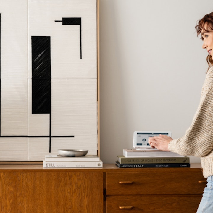 A simple Cove touchscreen panel by the door, easy for the whole family to use