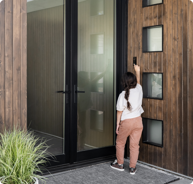 Woman pressing eufy doorbell