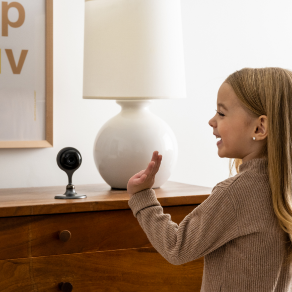 Little girl with indoor camera