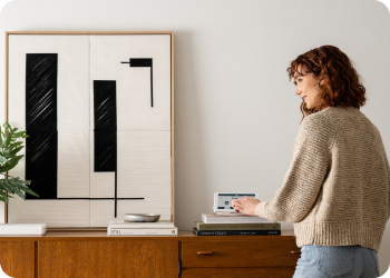 woman arming alarm panel