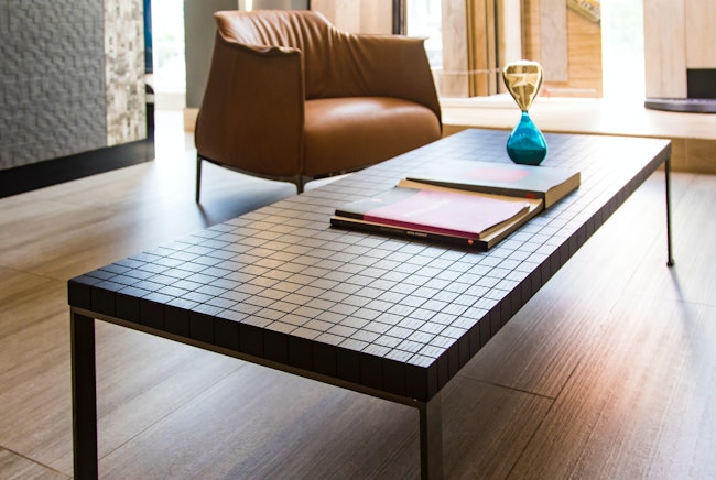 Coffee table at an Airbnb with an instruction binder.