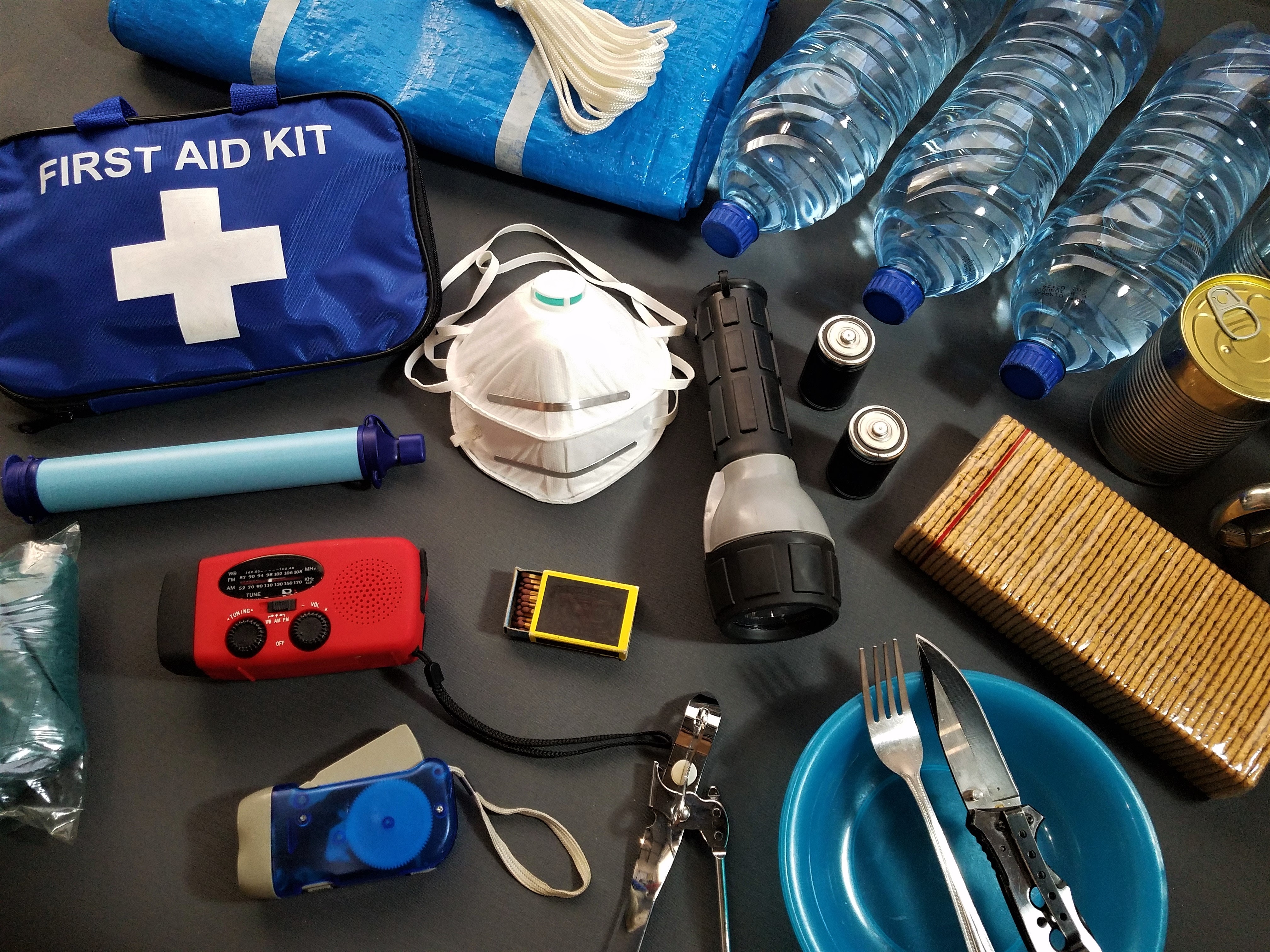 Emergency preparedness items such as a first aid kid, bottled water, masks, flashlight, etc.