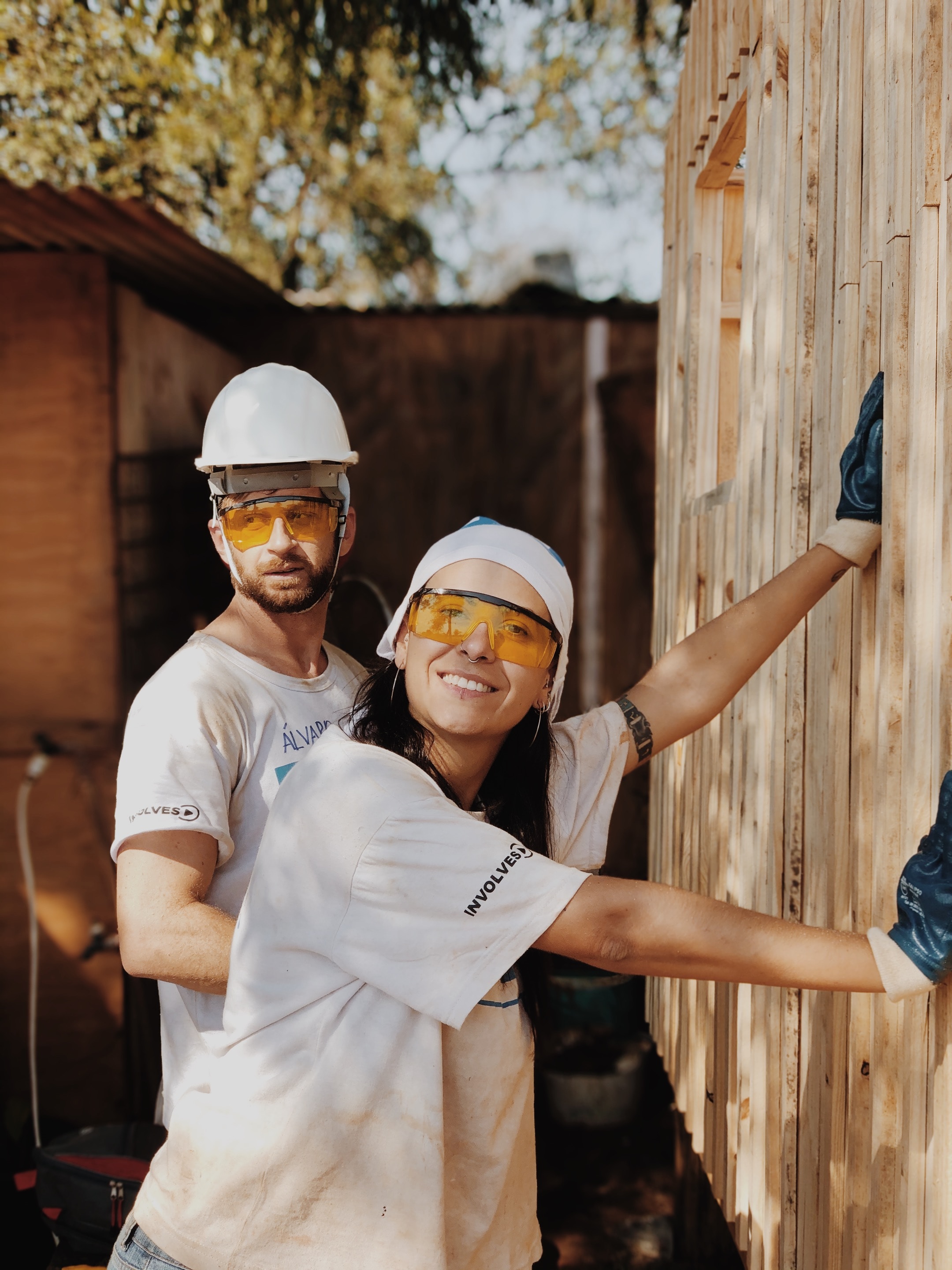 Couple with protective eye gear working on a DIY home rennovation.