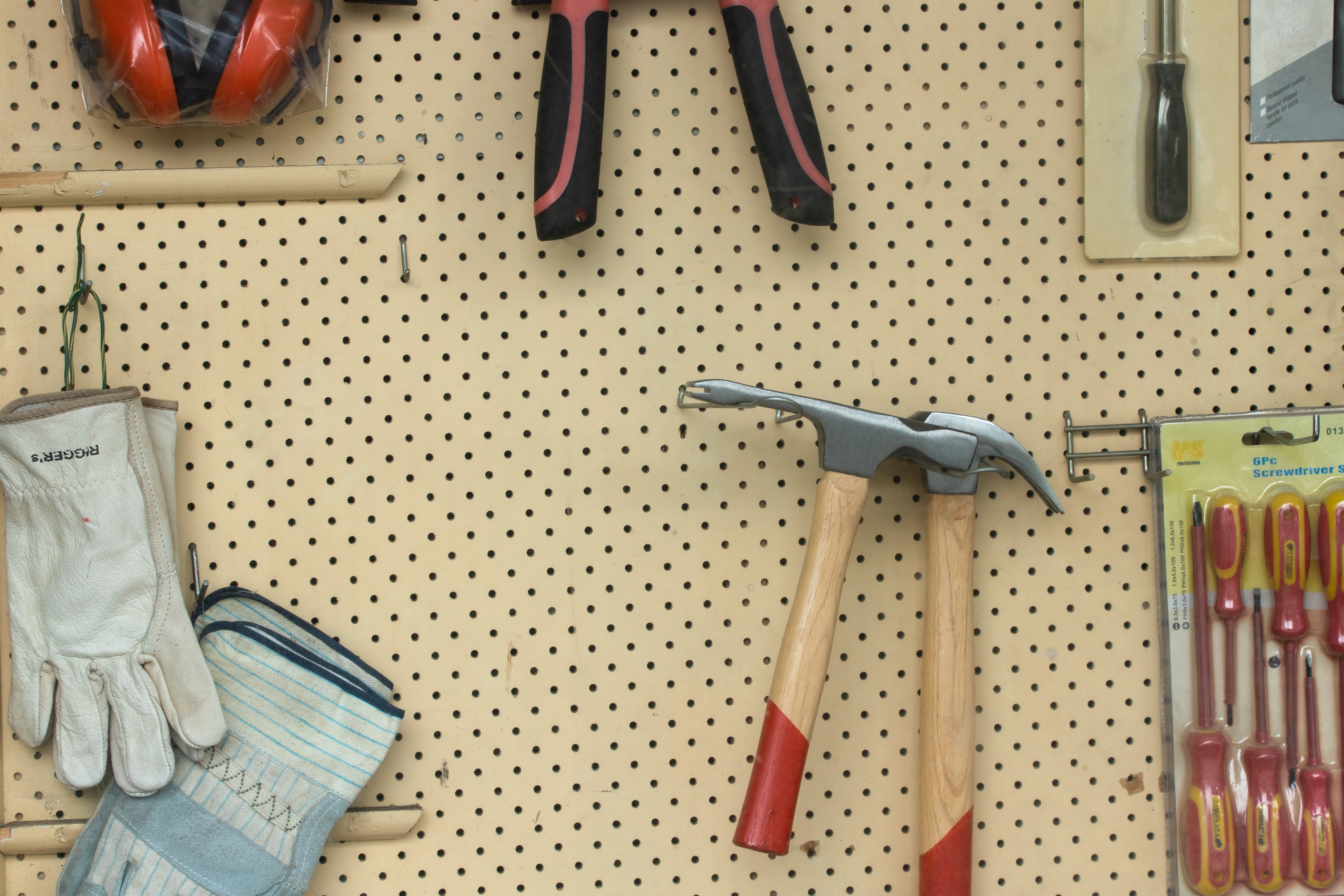 Common household tools on a pegboard.