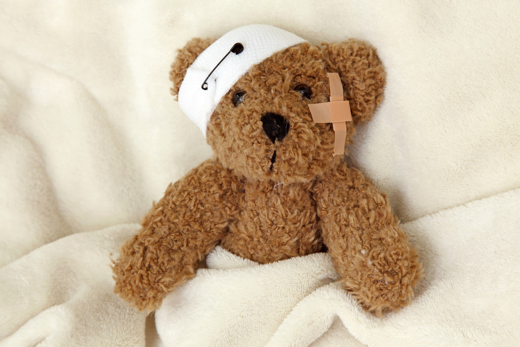 Teddy bear with bandages.