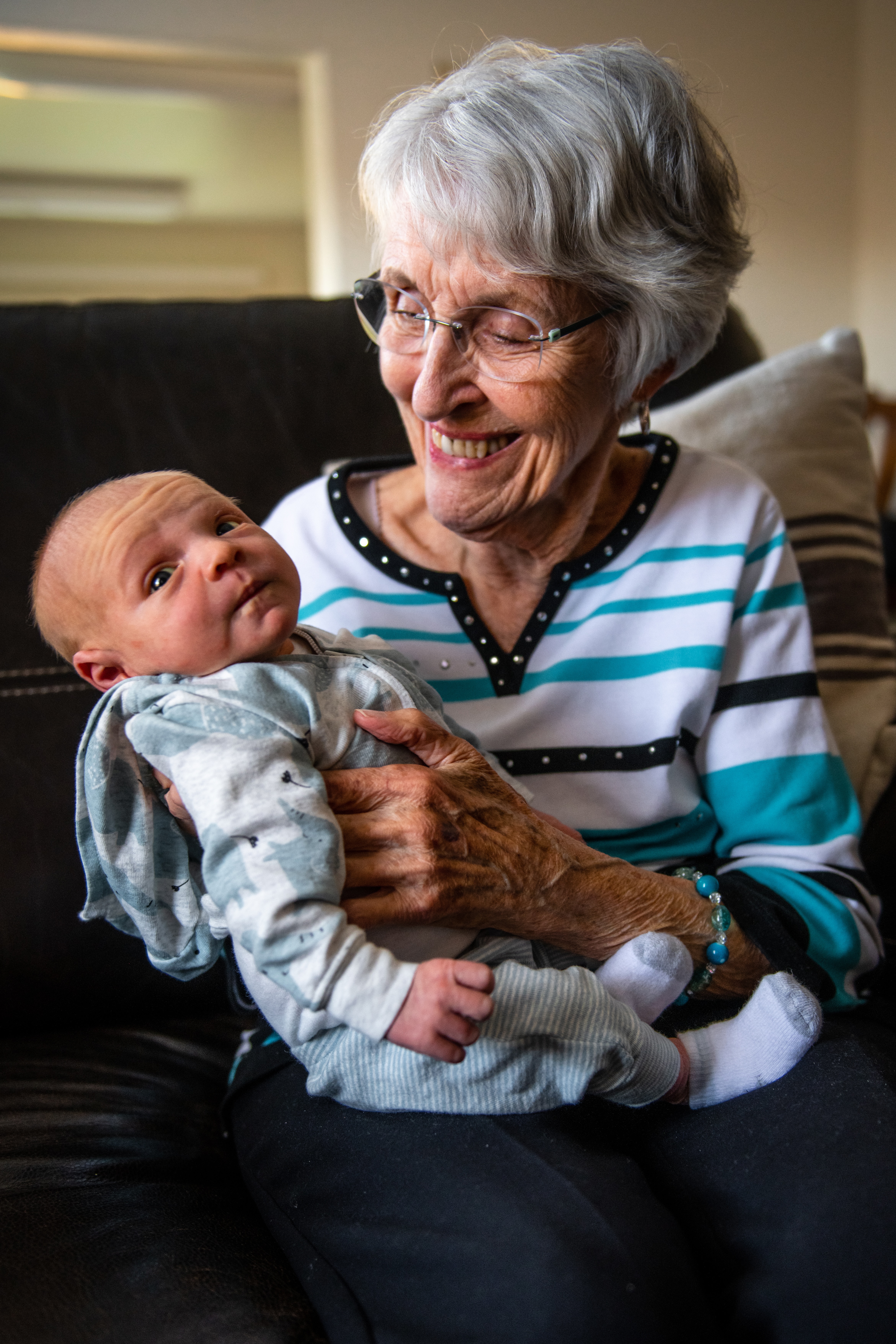 Baby Boomer grandma holding a grandkid.