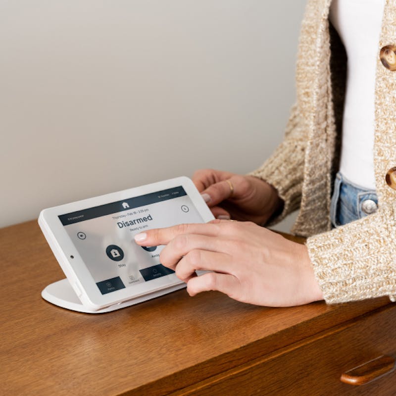 Woman using Coves security panel