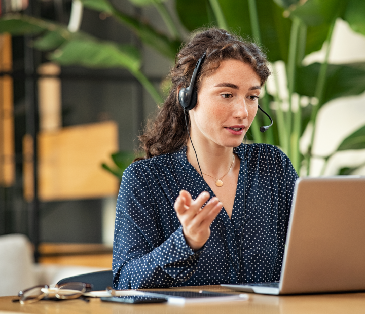 Woman with headset on a web call