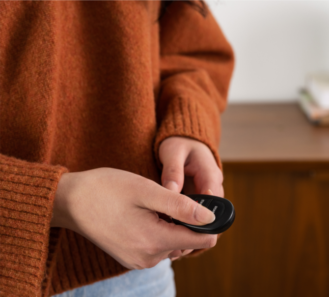 Woman pressing button on security key fob