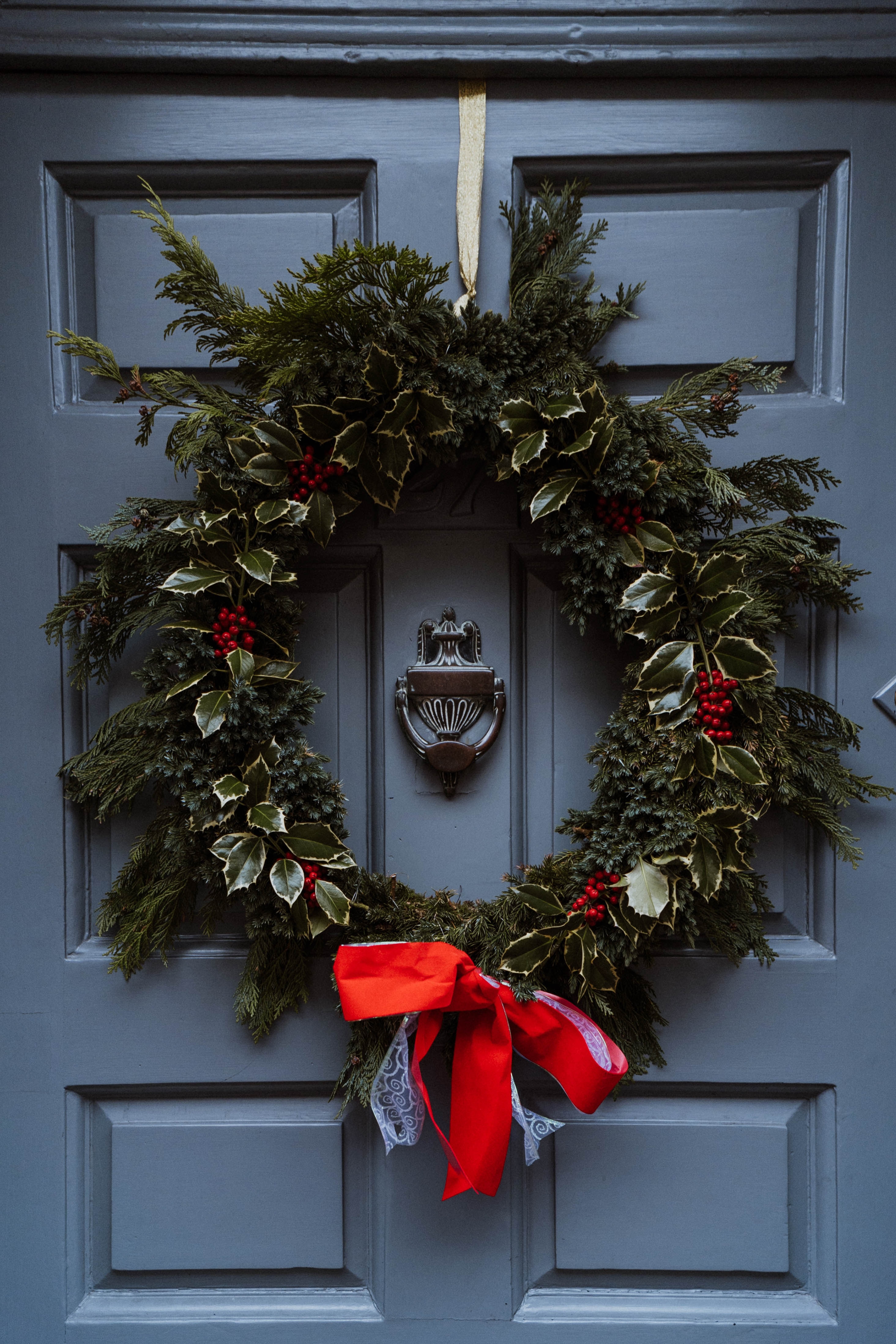 Holiday wreath on the front door of a home.