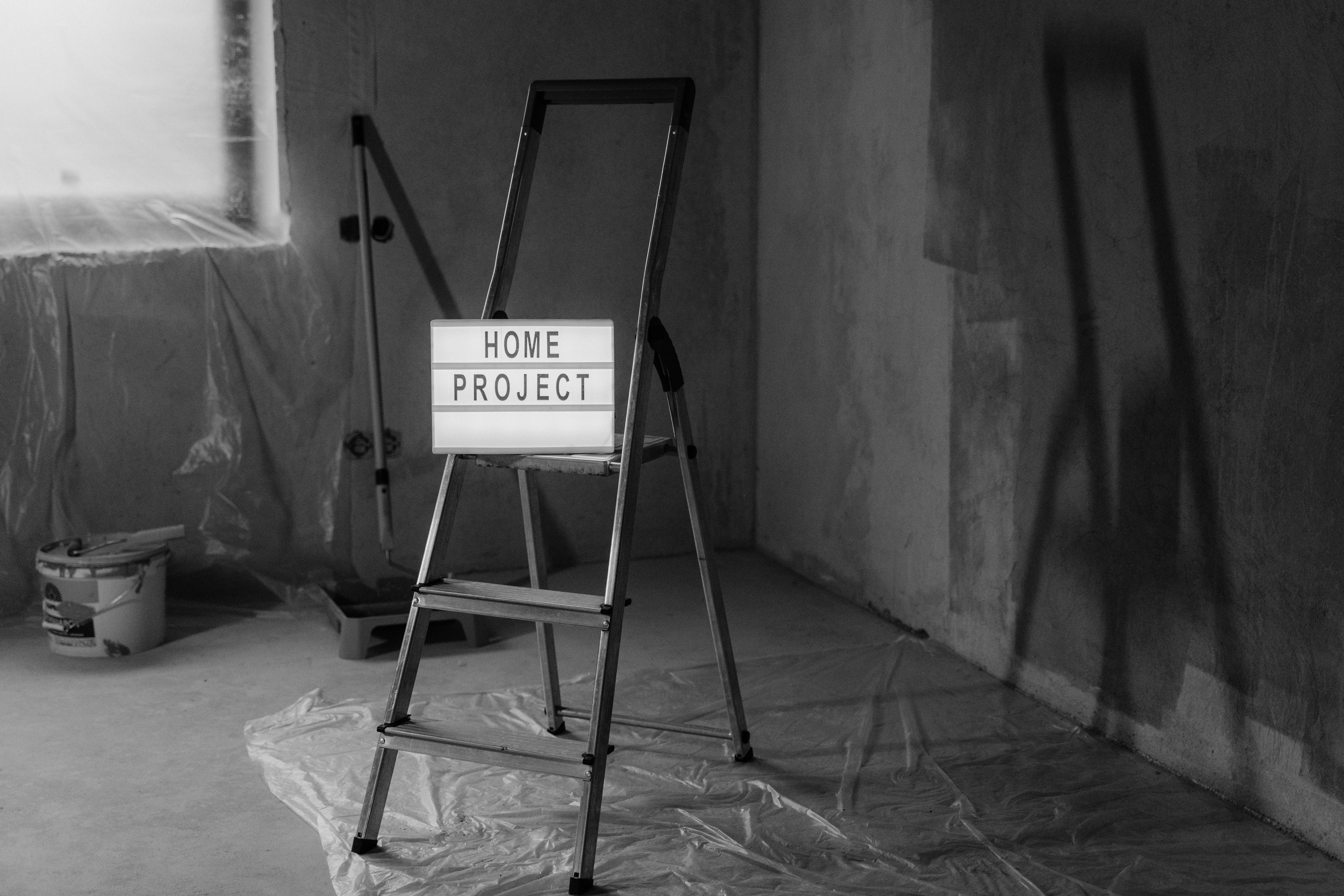 A step ladder in the middle of a DIY project.