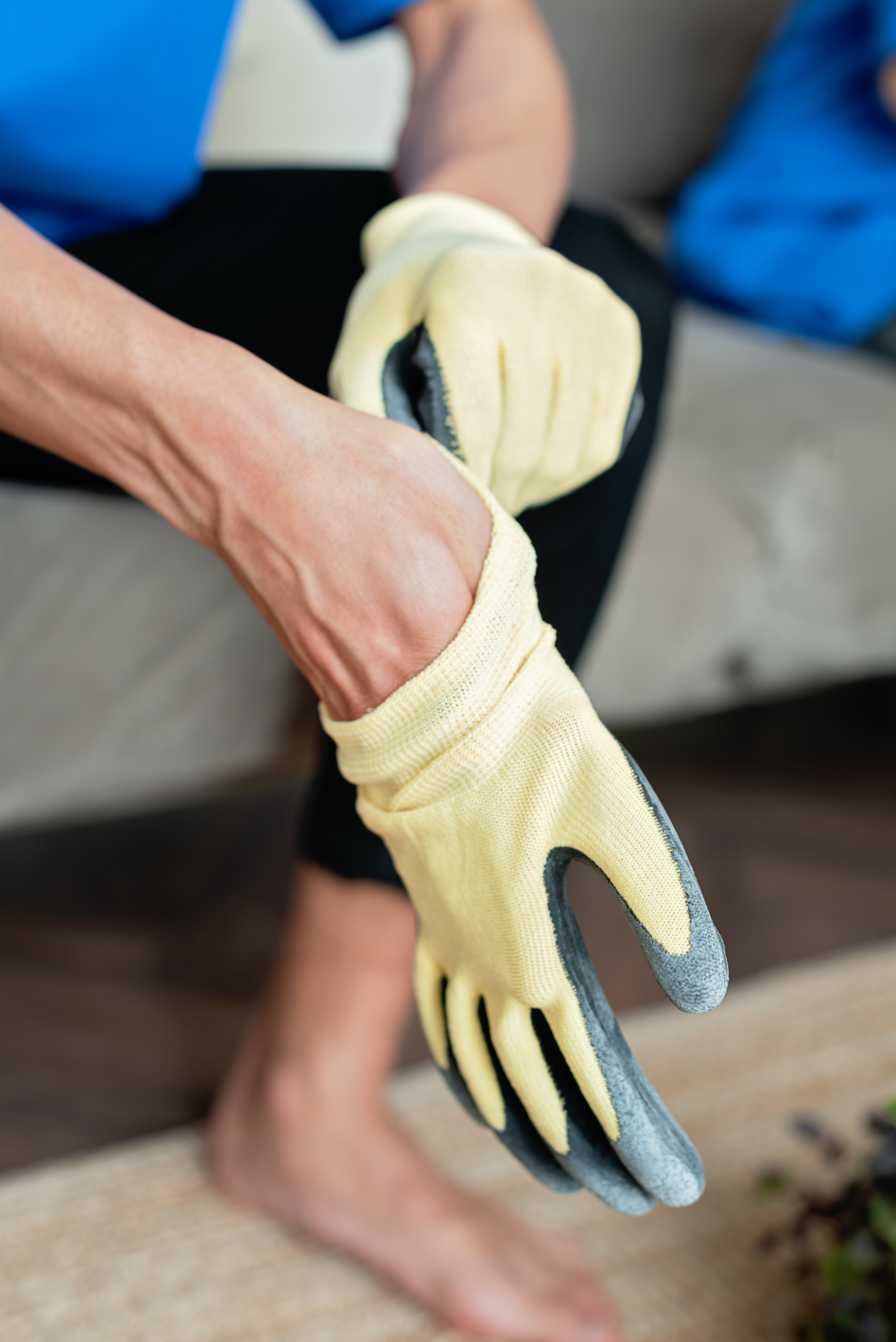 Man putting on work gloves.