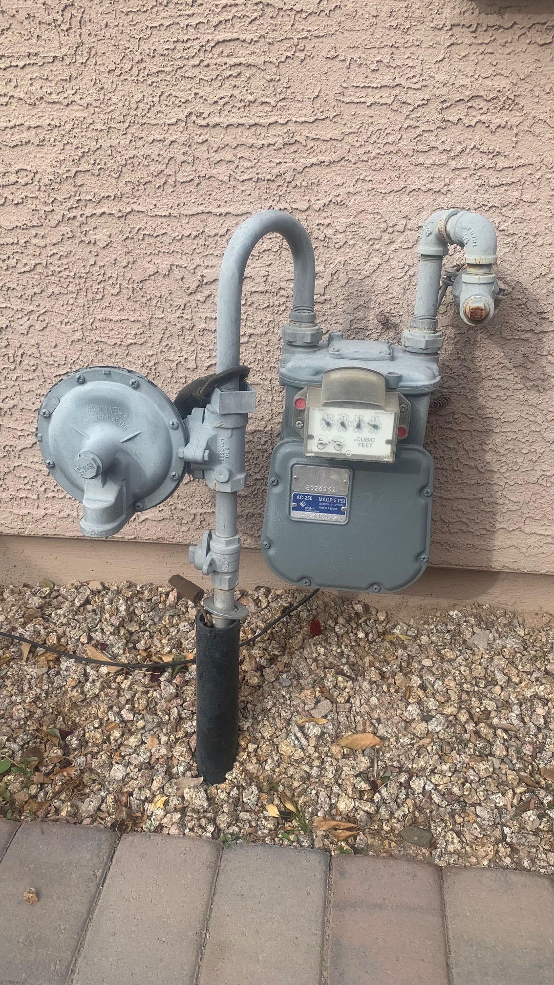 Gas line connection outside a home.
