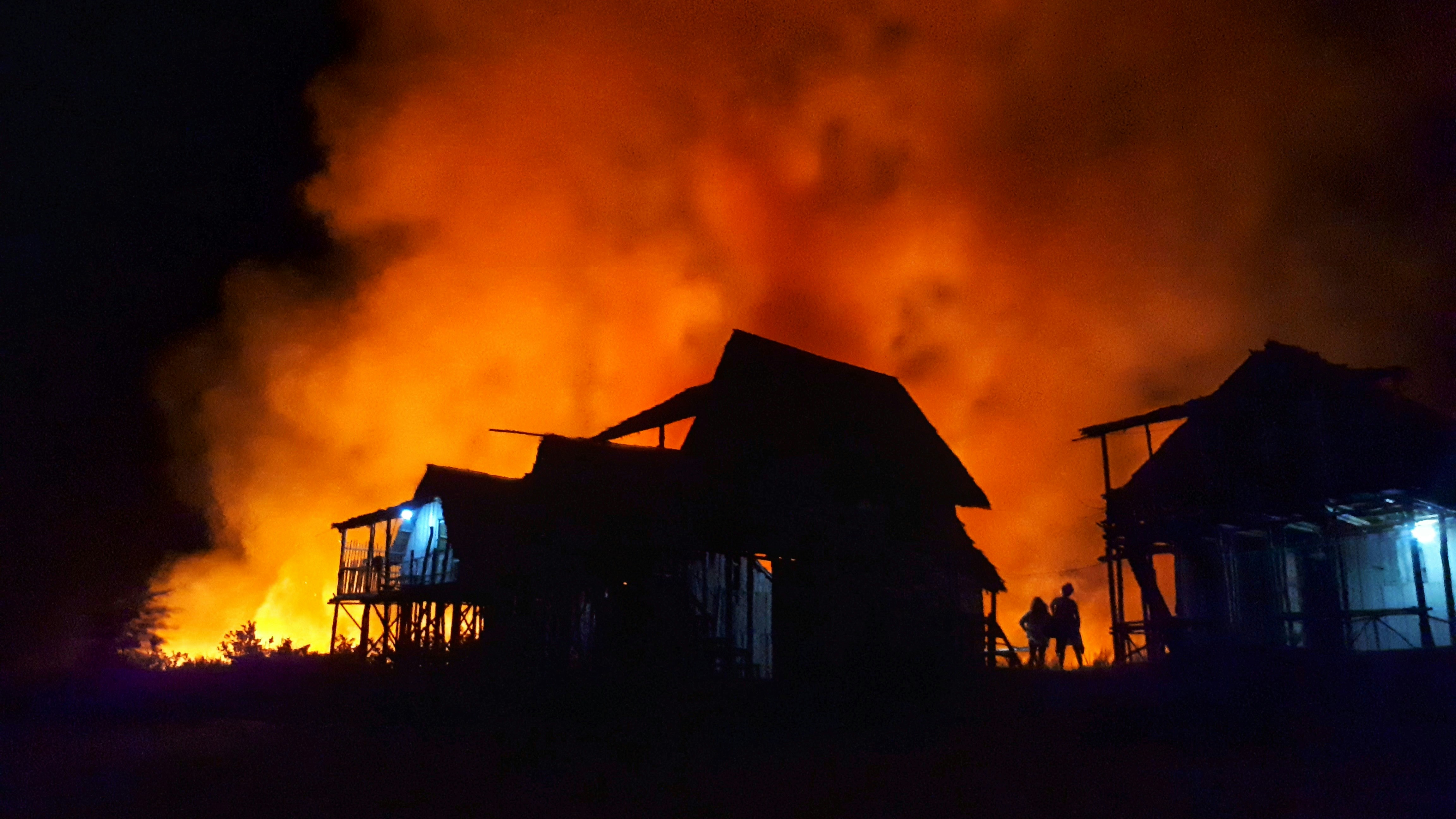 Fire fighters responding to a house fire.