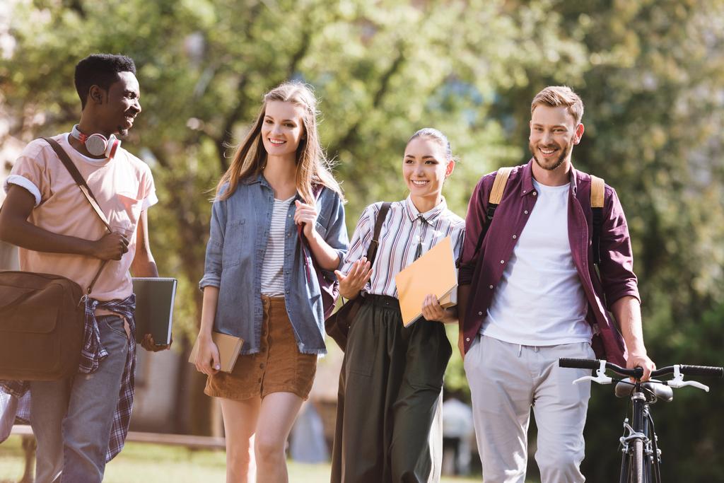 A group of new freshman college students moving into university.