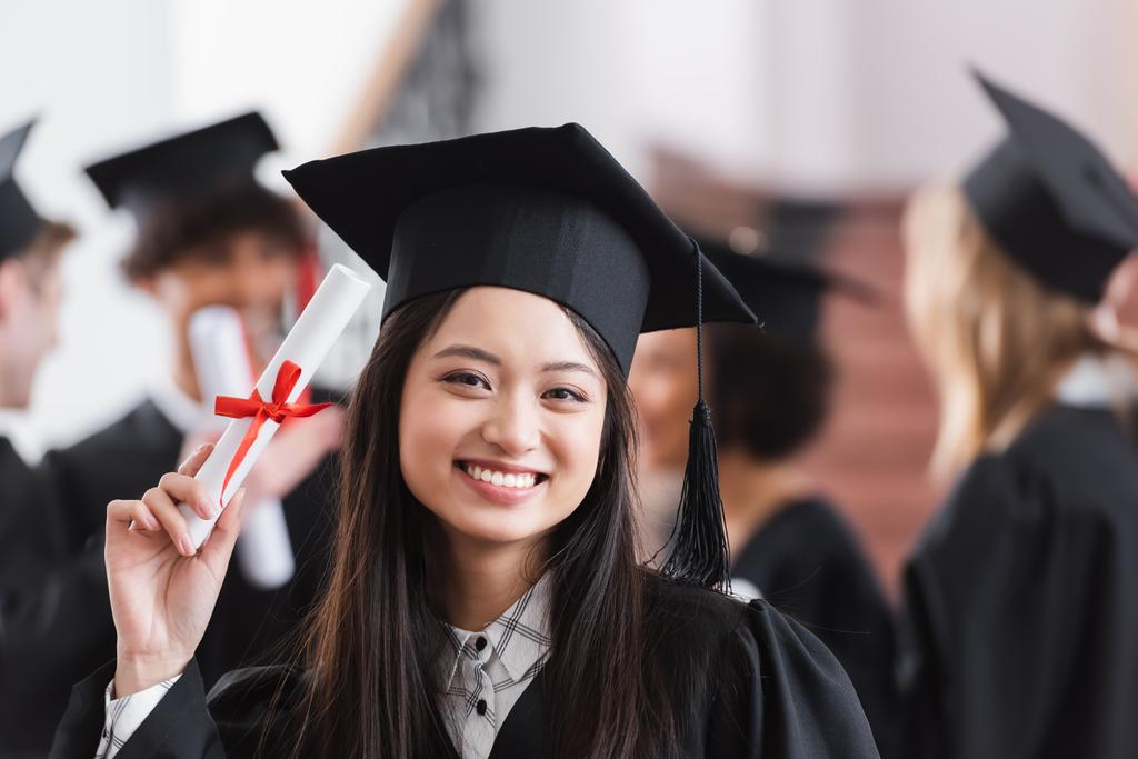 University graduation student with a diplma.