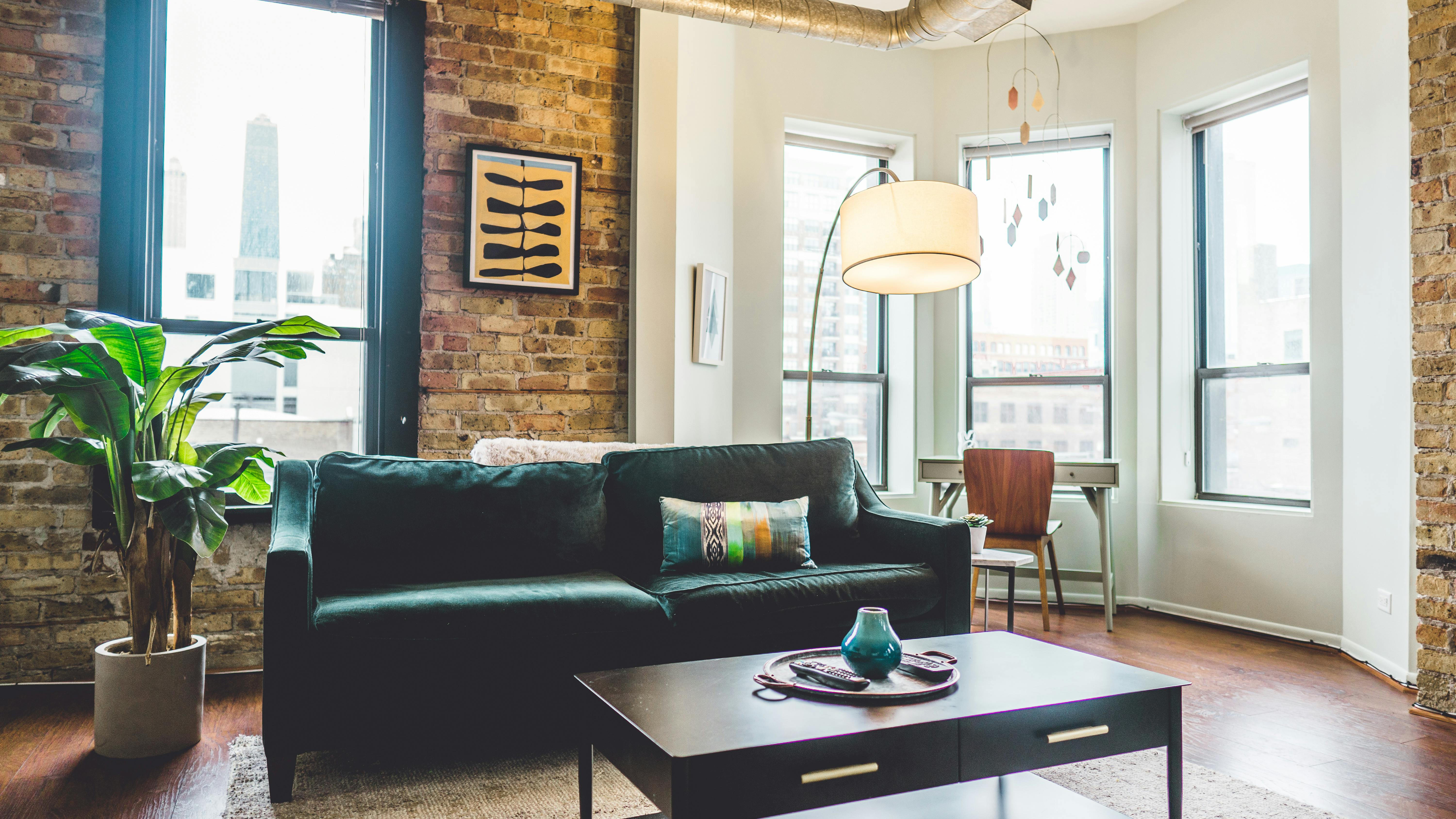 Apartment with brick walls and modern furniture.