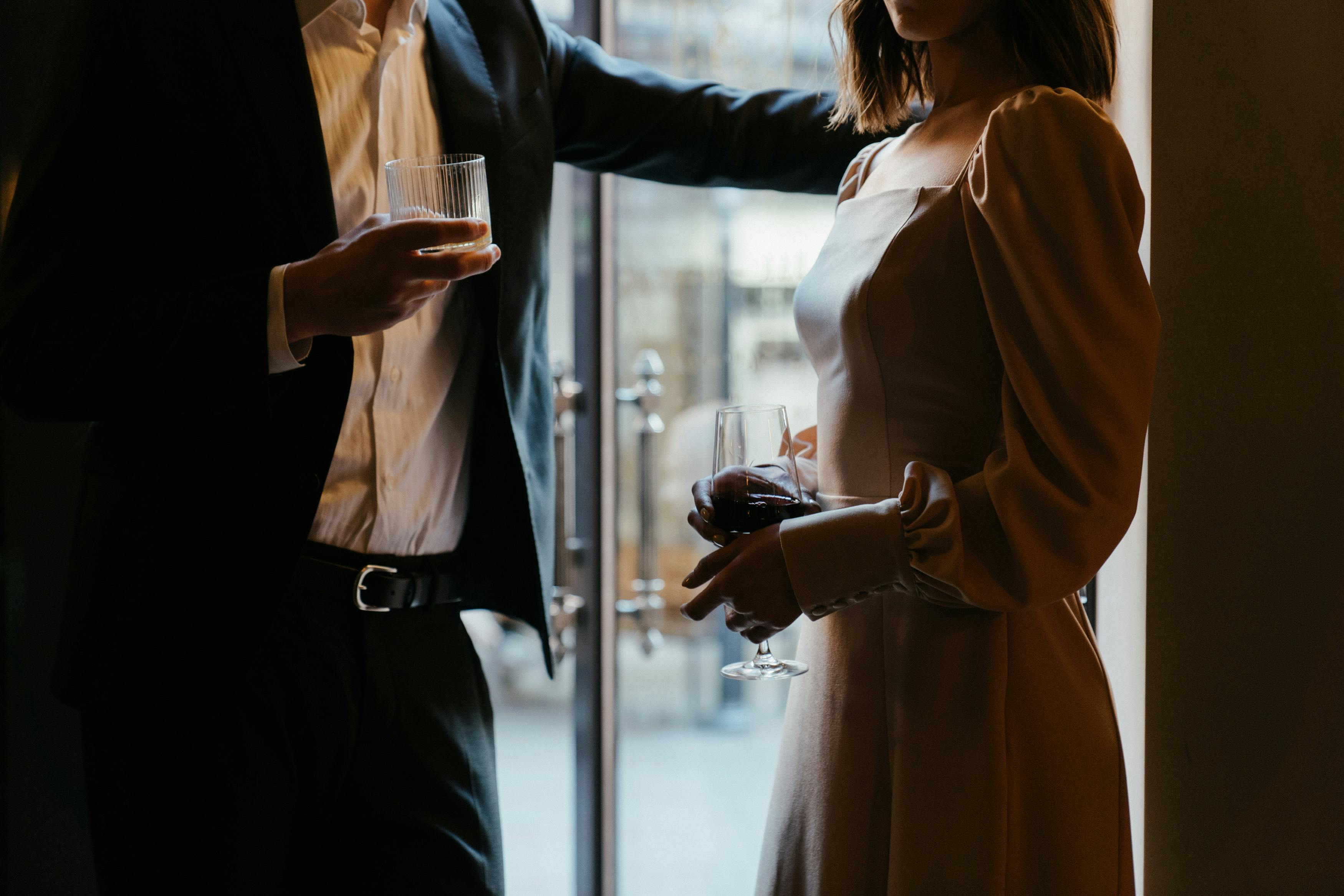 Man and woman on a date drinking wine.
