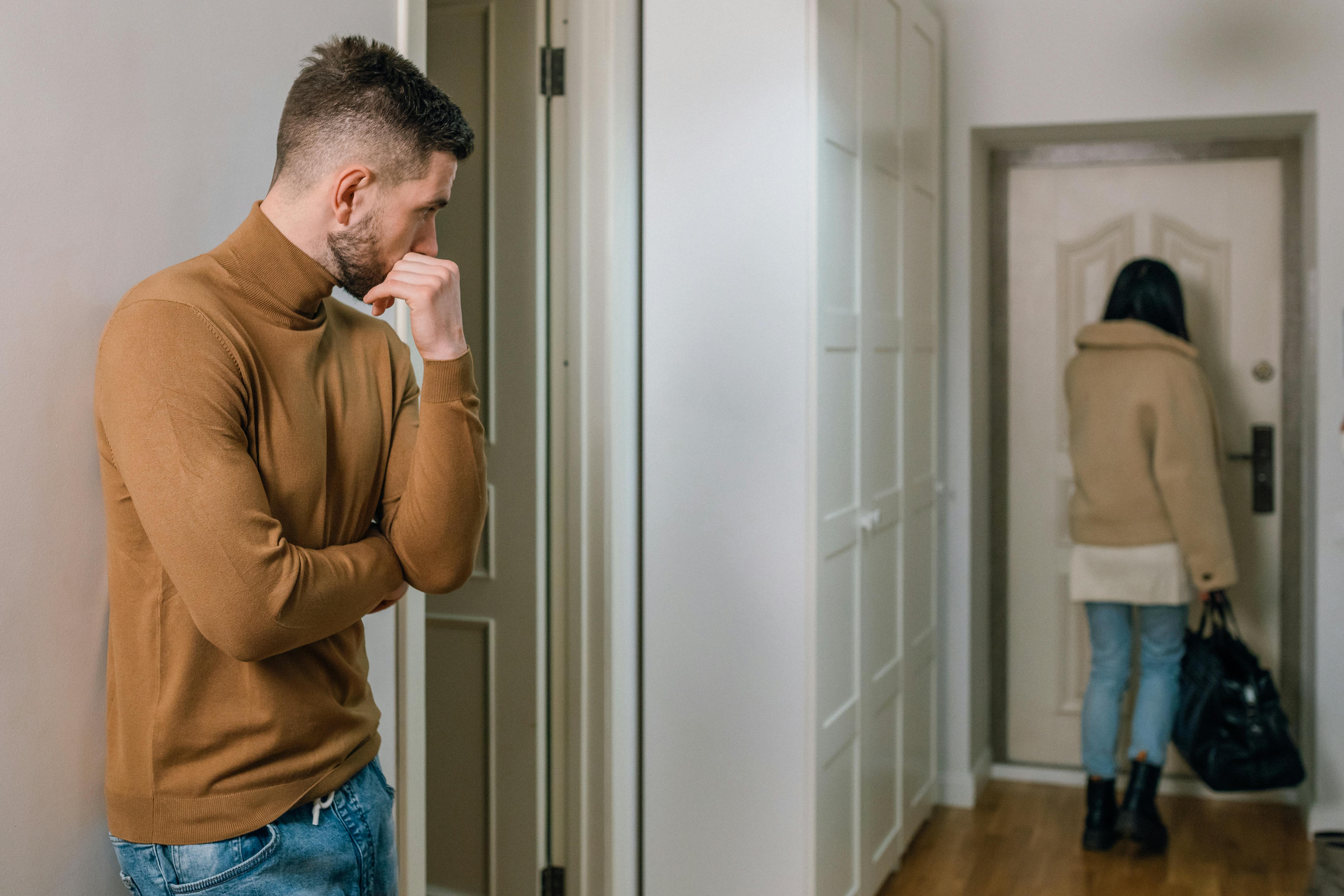 Man stalking a woman outside her apartment.