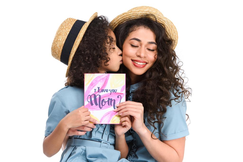 Daughter giving mom a Mother's Day card