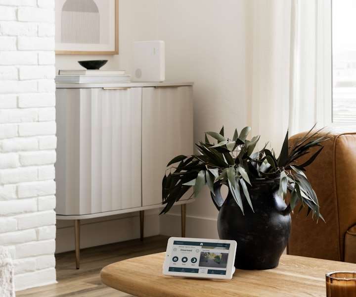 The Cove hub and touchscreen panel on a table