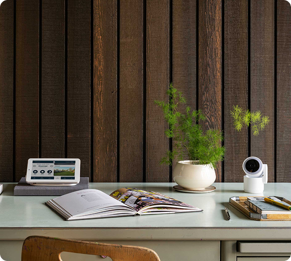 Cove Indoor Cam on desk with alarm panel