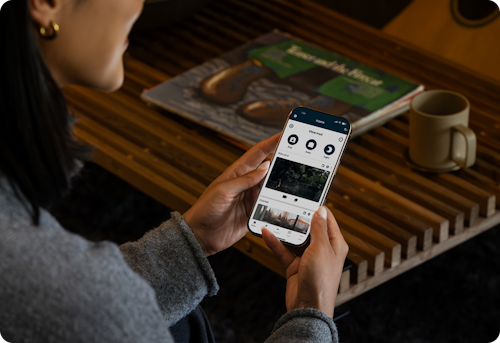Person viewing the Cove security system status on a mobile app