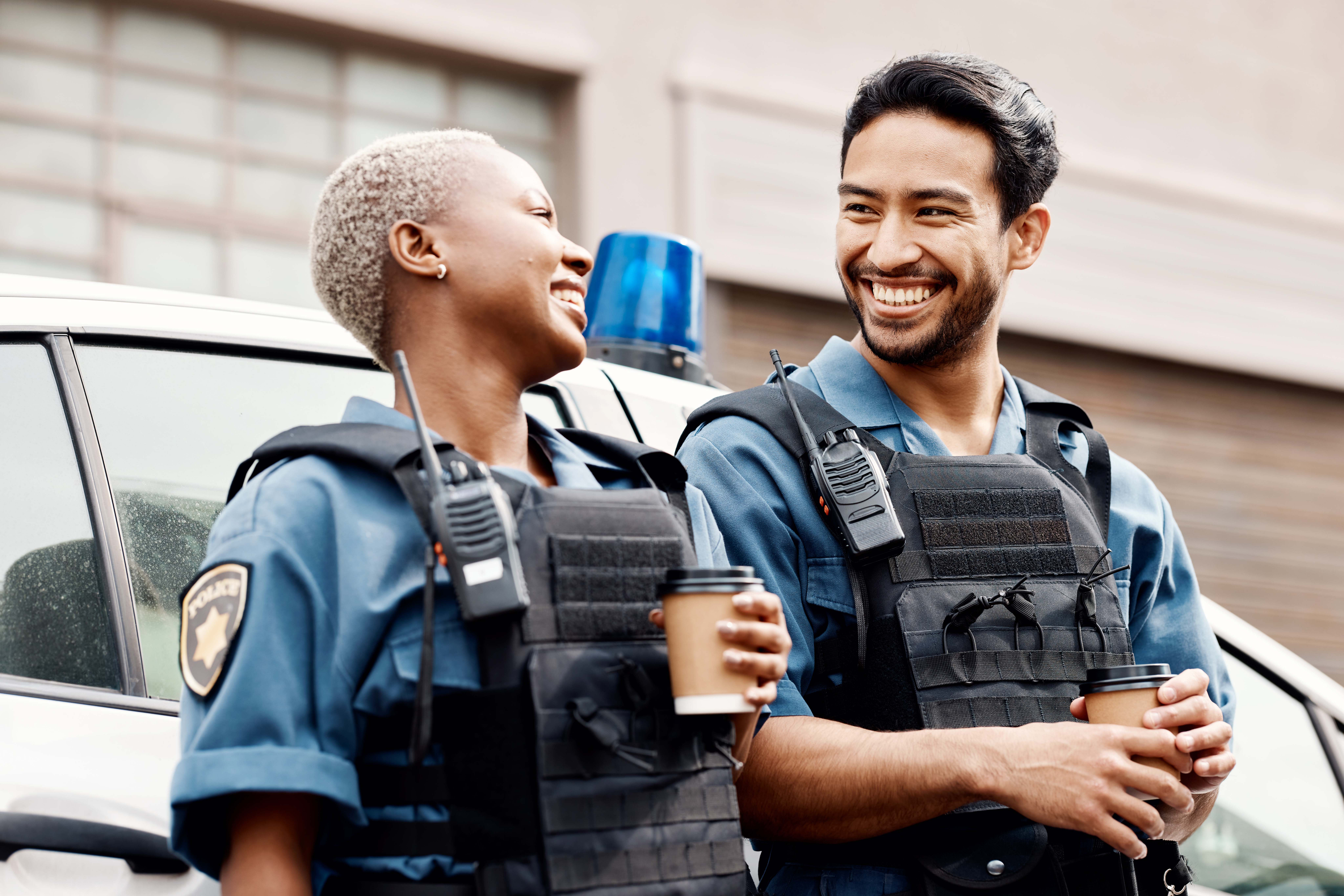 Two officers smiling
