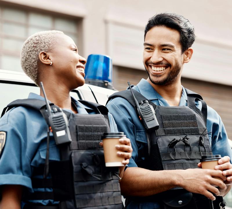 Two officers smiling