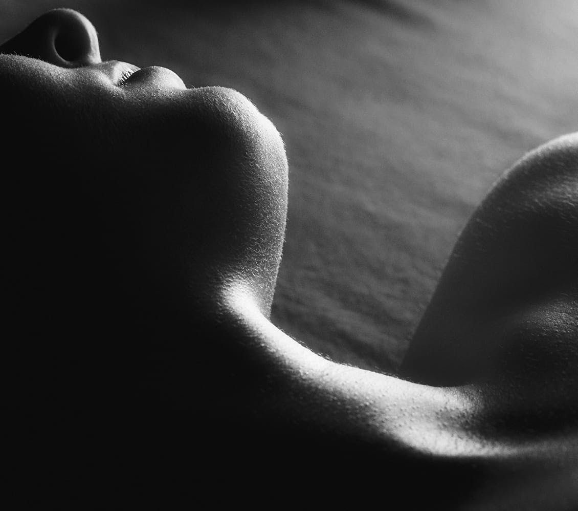 black and white image of a womans chin