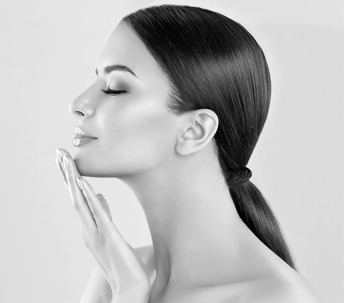 Woman with her hand on her face