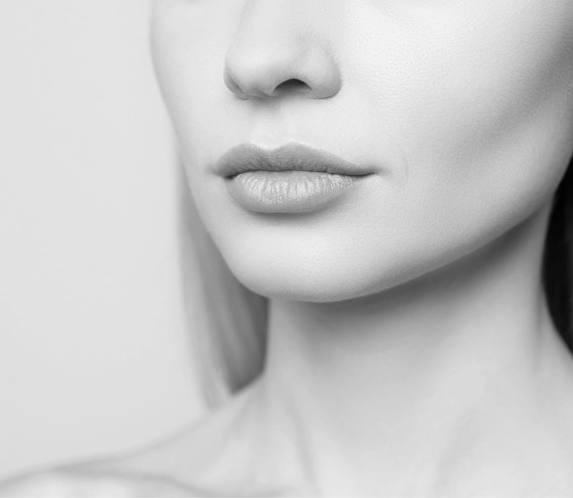 black and white photo of a woman's lower face