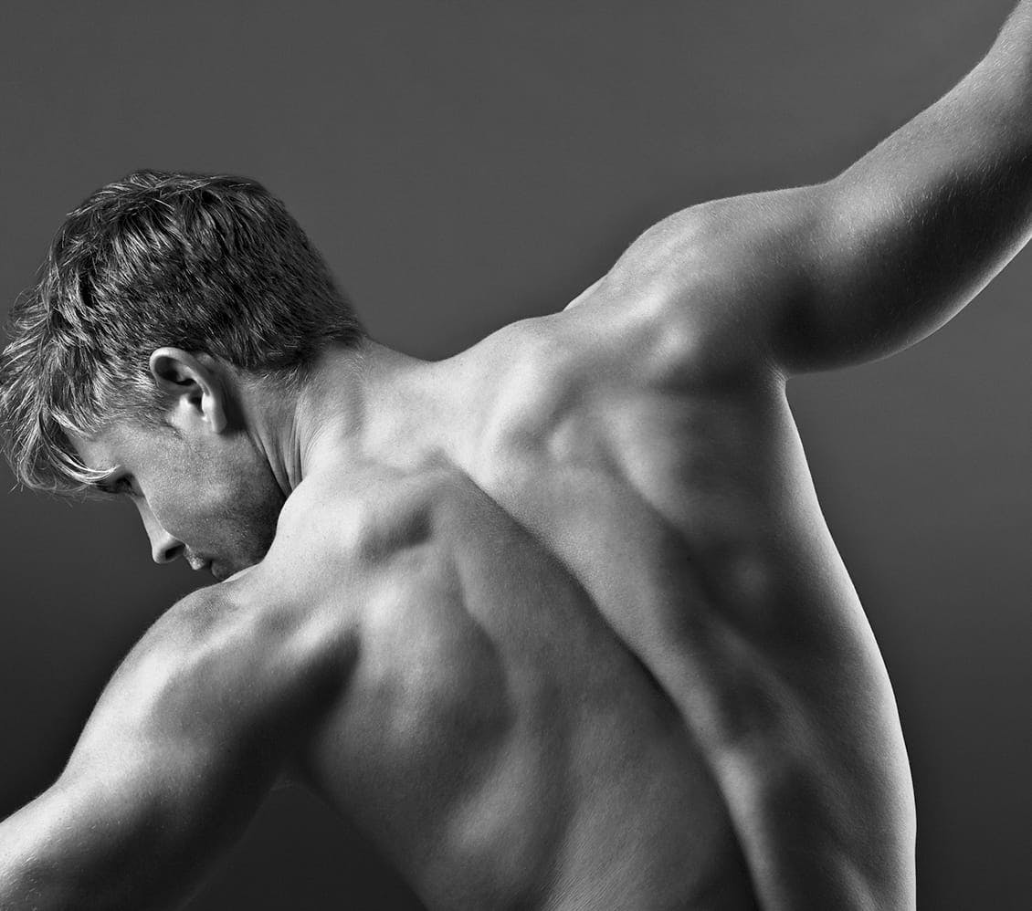black and white photo of a man's back